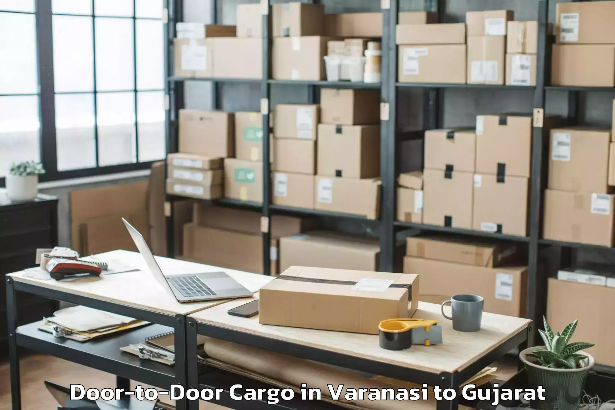 Professional Varanasi to Marwadi University Rajkot Door To Door Cargo